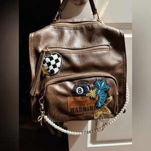 Brown Backpack or Shoulder style bag with Hand Stitched Decorative Patches